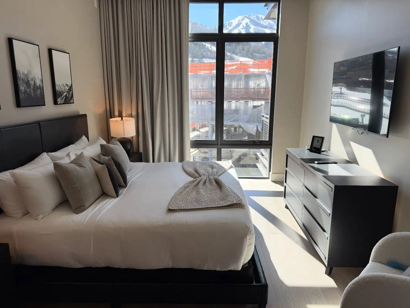 Guest ready bedroom with ski slope view after a vacation rental turnover in Park City, Utah
